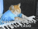 a cat wearing a blue shirt is playing a piano .