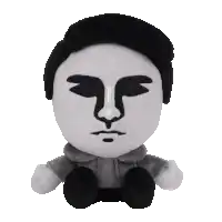 a stuffed toy with a black and white face