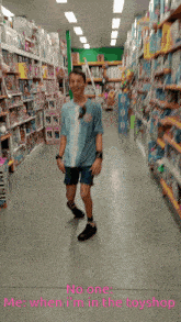 a boy is standing in a toy store with the words no one me when i 'm in the toyshop