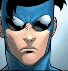 a close up of a superhero 's face with a mask on