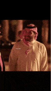 a man wearing a turban and a white shirt has the name tara on the bottom right
