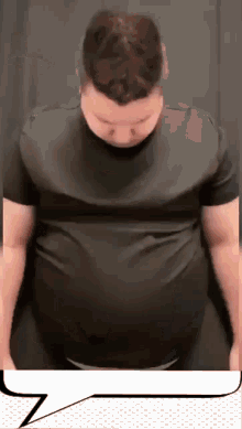 a man with a very large belly is wearing a black t-shirt .
