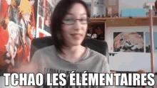 a woman wearing glasses is sitting in a chair with the words tchao les elementares written on the bottom