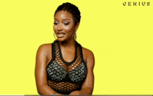 a woman in a black tank top says money