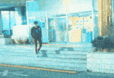 a man is walking down stairs in front of a building with a sign on it that says ' a ' on it