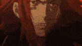 a close up of a man 's face with long red hair