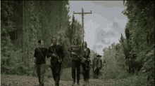Marching - Walking Dead GIF - Walking Dead Group Marching GIFs