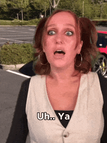 a woman with pigtails is making a funny face and says uh ya