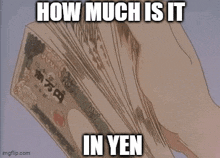 a person is holding a stack of yen bills in their hand ..
