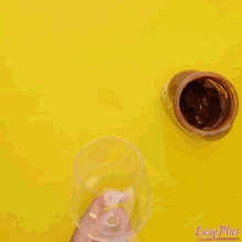 a person pouring peanut flour into a bowl
