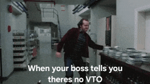 a man is running in a hallway with the words when your boss tells you there 's no vto on the bottom