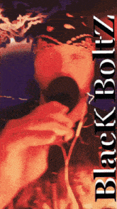 a poster of a man singing into a microphone with the words black boltz on the bottom