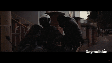 a person riding a motorcycle down a street with the word daymollton on the bottom