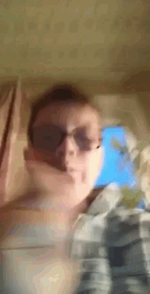 a blurry photo of a man wearing sunglasses