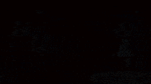 a girl with blue hair is standing next to a boy in a chair with the name bellathewolf on the bottom