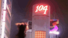 a building with the number 104 on the top of it