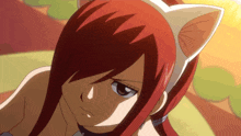 a girl with red hair has a cat ear headband on