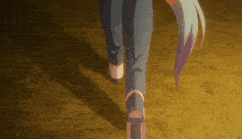 a person 's feet are shown in a close up with the letter h on their shoe