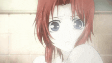 a girl with red hair and blue eyes looks very sad