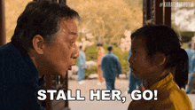 a man and a little girl are looking at each other and the little girl says stall her go