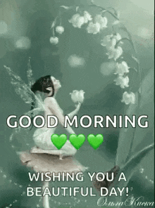 a fairy is sitting on a rock next to a lily of the valley and holding flowers .