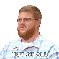 a man with glasses and a beard has the words not at all on his shirt