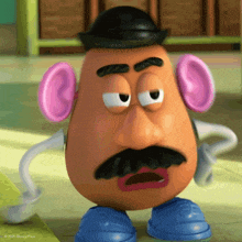 a mr potato head from toy story with a hat and ears