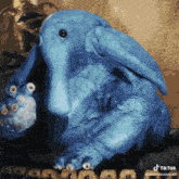 a blue stuffed animal with a tiktok watermark on the bottom right corner