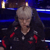 a person wearing headphones and a goalstudio jacket