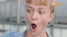 a woman with a surprised look on her face is behind a pet collective logo