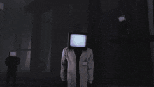 a man in a lab coat has a tv head on his head
