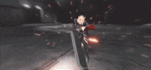 a person in a red cape is holding a sword