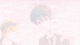 a couple of anime characters are standing next to each other .