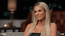 a woman sitting on a couch with the hashtag # mafs on the bottom