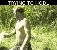 a shirtless man is running through a field with the words trying to hodl written on the bottom .