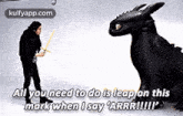 a man with a sword is standing next to a large black dragon .
