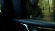 a man in a suit and tie says " kill him " in white letters