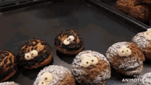 a bunch of cupcakes are on a tray with the words made in animatica on the bottom