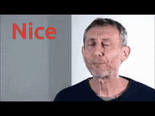 a man with his eyes closed is standing in front of a sign that says nice