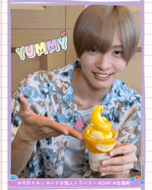 a man holding a cup of yummy ice cream in his hand