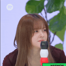 a close up of a woman 's face with the name haewon on the bottom right