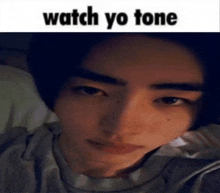 a close up of a person 's face with the caption watch yo tone