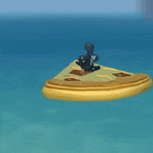 a slice of pizza floating in the ocean