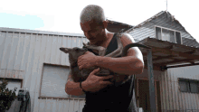 Hugging A Kangaroo Dean Schneider GIF - Hugging A Kangaroo Dean Schneider Carrying GIFs
