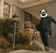 a man with a pixelated face on his face is running down stairs
