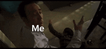 a person 's hand is reaching out towards another person with the words `` me '' written on the screen .