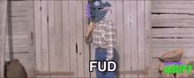 a cartoon of a man holding a rope with fud written on the bottom