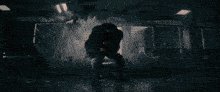 a person is standing in front of a large light