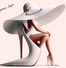 a woman wearing a large white hat sits on a white shoe