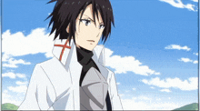 a person with a cross on their collar is standing in front of a blue sky